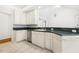 Kitchen featuring white cabinets, modern appliances, and tile flooring at 3404 Apple Meadow Dr, Fuquay Varina, NC 27526