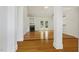 Bright living room features wood floors, fireplace, and French doors leading to the backyard at 3404 Apple Meadow Dr, Fuquay Varina, NC 27526
