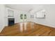 An open living area with marble fireplace, french doors and view to the kitchen at 3404 Apple Meadow Dr, Fuquay Varina, NC 27526