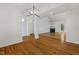 Bright living room featuring hardwood floors, fireplace and french doors leading to outdoor space at 3404 Apple Meadow Dr, Fuquay Varina, NC 27526