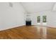 Spacious living room with vaulted ceilings, a fireplace, and french doors to backyard at 3404 Apple Meadow Dr, Fuquay Varina, NC 27526