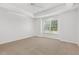 Large bedroom with a tray ceiling, ceiling fan and a large window at 3404 Apple Meadow Dr, Fuquay Varina, NC 27526