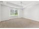 Spacious bedroom with a large window and neutral carpet at 3404 Apple Meadow Dr, Fuquay Varina, NC 27526