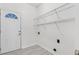 Mud room with white door, shelving, and tile floor at 3404 Apple Meadow Dr, Fuquay Varina, NC 27526