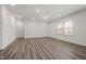 Empty bedroom with hardwood floors, recessed lighting, neutral paint, and ample natural light at 353 Bridle Brook Way, Fuquay Varina, NC 27526
