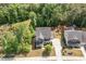 Aerial view of the home showcasing its spacious lot with lush landscaping and mature trees at 3609 Jordan Shires Dr, New Hill, NC 27562