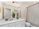 Bathroom features a double sink vanity, framed mirror, and shower-tub combo at 3609 Jordan Shires Dr, New Hill, NC 27562