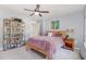 Inviting bedroom with wood bed frame, bedside table, and bookshelf at 3609 Jordan Shires Dr, New Hill, NC 27562