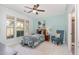 Bright bedroom featuring a ceiling fan, a cozy reading chair, and large windows that let in plenty of natural light at 3609 Jordan Shires Dr, New Hill, NC 27562