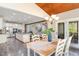 Bright dining area with access to an updated kitchen, and an adjacent staircase at 3609 Jordan Shires Dr, New Hill, NC 27562