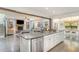 Bright kitchen with an island, stainless steel appliances, and seamless flow to the dining and living areas at 3609 Jordan Shires Dr, New Hill, NC 27562