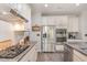 Modern kitchen with granite countertops, stainless steel appliances, and ample cabinet space at 3609 Jordan Shires Dr, New Hill, NC 27562