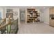 Spacious loft with custom bookshelf and stairs with wrought iron railing at 3609 Jordan Shires Dr, New Hill, NC 27562