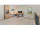 Spacious loft area with carpeted floor, built-in cabinets, and a desk area at 3609 Jordan Shires Dr, New Hill, NC 27562