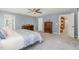 Open and airy main bedroom with neutral paint and carpeting at 3609 Jordan Shires Dr, New Hill, NC 27562