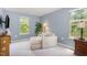 Relaxing sitting area with a chaise lounge and natural light from the windows at 3609 Jordan Shires Dr, New Hill, NC 27562