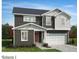 Charming two-story home with a two-car garage, gray and white siding, and a well-manicured front lawn at 361 Spelt Ct, Rolesville, NC 27571
