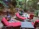 This home features a private backyard patio area with a firepit, ample seating, and an outdoor grill at 404 Emerywood Dr, Raleigh, NC 27615