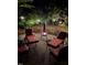 Relax in the evening by the glowing fire pit on this home's private brick patio with ample lounge chair seating at 404 Emerywood Dr, Raleigh, NC 27615