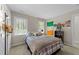 Cozy bedroom filled with natural light offers comfort and character at 404 Emerywood Dr, Raleigh, NC 27615