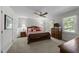 Primary bedroom with ceiling fan, carpeting and natural light at 404 Emerywood Dr, Raleigh, NC 27615