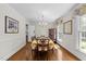 Formal dining room featuring hardwood floors, a chandelier, and ample space for entertaining at 404 Emerywood Dr, Raleigh, NC 27615