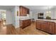 Wet bar area featuring granite countertops, cherry cabinets and wine rack at 404 Emerywood Dr, Raleigh, NC 27615