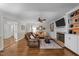 Living room with hardwood floors, fireplace and built-in shelving at 404 Emerywood Dr, Raleigh, NC 27615