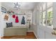 Organized mudroom features storage bench and convenient hooks at 404 Emerywood Dr, Raleigh, NC 27615