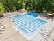 An aerial view of the community swimming pool, complete with lap lanes, lounge chairs, and a diving board at 404 Emerywood Dr, Raleigh, NC 27615