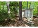 The property includes a shed with double doors, a ramp, and convenient storage in a wooded setting at 404 Emerywood Dr, Raleigh, NC 27615