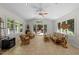 Sunroom with tile flooring and backyard access at 404 Emerywood Dr, Raleigh, NC 27615