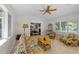 Bright sunroom with tile floors, comfortable seating, and natural light at 404 Emerywood Dr, Raleigh, NC 27615