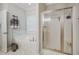 Bathroom boasts a soaking tub and glass shower with natural light at 4072 Mackenzie Dr, Haw River, NC 27258