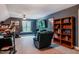 This large bonus room has a seating area, workout area, and display shelving at 4072 Mackenzie Dr, Haw River, NC 27258