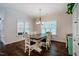 Dining area with hardwood floors and an abundance of natural light at 4072 Mackenzie Dr, Haw River, NC 27258