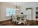 Inviting dining room featuring a chandelier and natural light at 4072 Mackenzie Dr, Haw River, NC 27258
