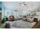 Open concept living room with hardwood floors and access to outdoor patio at 4072 Mackenzie Dr, Haw River, NC 27258