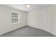 Bedroom with a window, carpeted floors, light and bright paint at 410 Caswell St, Burlington, NC 27217