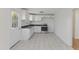 Recently updated kitchen featuring sleek white cabinetry, granite countertops, and stainless steel appliances at 410 Caswell St, Burlington, NC 27217