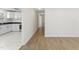 Bright living room with new laminate flooring leading to an updated kitchen with granite countertops at 410 Caswell St, Burlington, NC 27217