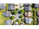 Aerial view of a neighborhood cul-de-sac showcasing lush green lawns, mature trees, and well-maintained homes at 4116 Argyle Trl, Burlington, NC 27215