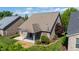 Aerial shot of a brick home featuring a covered patio and nice landscaping at 4116 Argyle Trl, Burlington, NC 27215