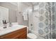 Bathroom features a shower-tub combo with vanity and floral shower curtain at 4116 Argyle Trl, Burlington, NC 27215