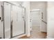 Bathroom featuring a glass enclosed shower and a glimpse into the walk-in closet at 4116 Argyle Trl, Burlington, NC 27215