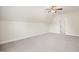 Bright bedroom featuring carpet flooring, a ceiling fan, and entry to the en suite at 4116 Argyle Trl, Burlington, NC 27215