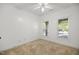 Neutral bedroom with carpet flooring, two windows, and ample space, offering a cozy retreat at 4116 Argyle Trl, Burlington, NC 27215