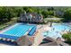 Aerial view featuring a luxurious community pool with lap lanes, splash zone, and comfortable seating areas at 4116 Argyle Trl, Burlington, NC 27215