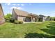 Beautiful backyard with brick exterior and covered patio at 4116 Argyle Trl, Burlington, NC 27215