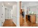 Spacious open kitchen with wood cabinets, granite countertops, and hardwood flooring at 4116 Argyle Trl, Burlington, NC 27215